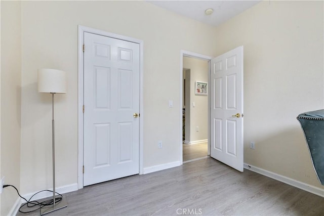 bedroom with light hardwood / wood-style floors