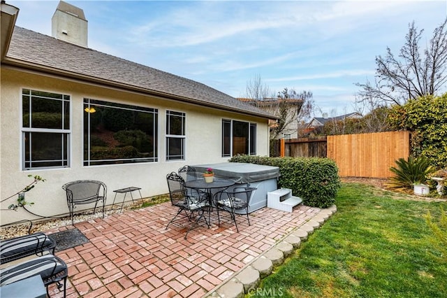 view of patio with a hot tub