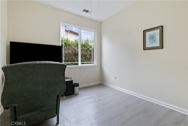 sitting room featuring light wood-type flooring