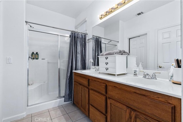 bathroom featuring a shower with curtain, vanity, and tile patterned flooring