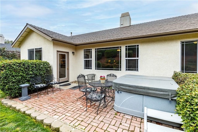 view of patio with a hot tub