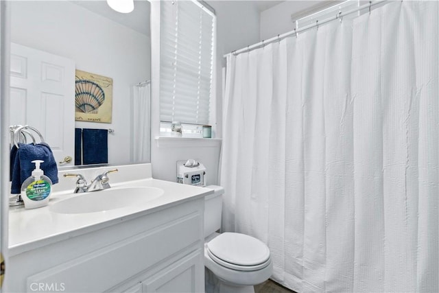 bathroom with vanity and toilet