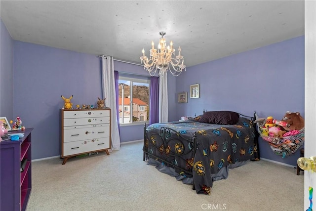 bedroom featuring carpet flooring, a notable chandelier, and baseboards