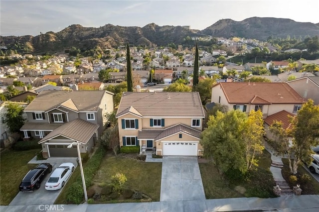 drone / aerial view featuring a mountain view and a residential view