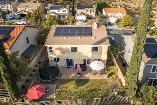 birds eye view of property with a residential view