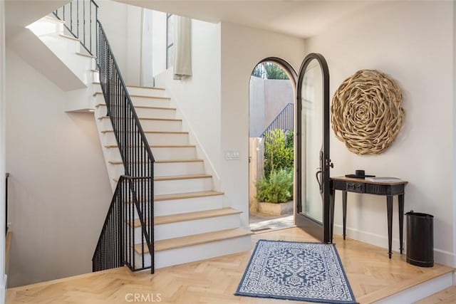 foyer with light parquet flooring