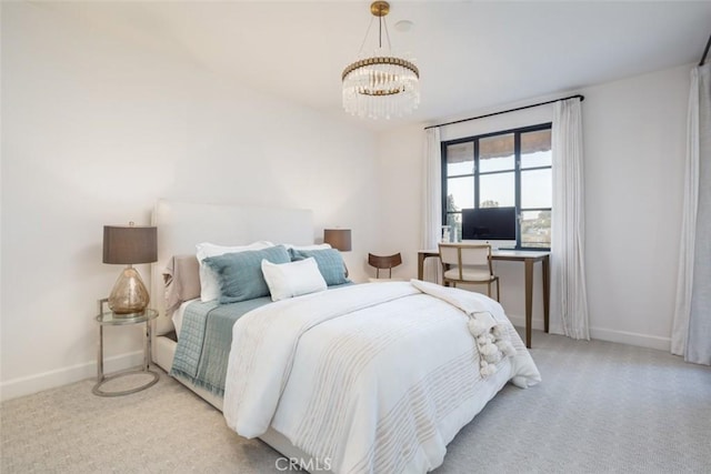 carpeted bedroom with a chandelier