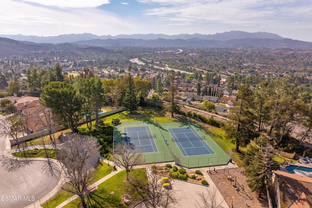 birds eye view of property with a mountain view