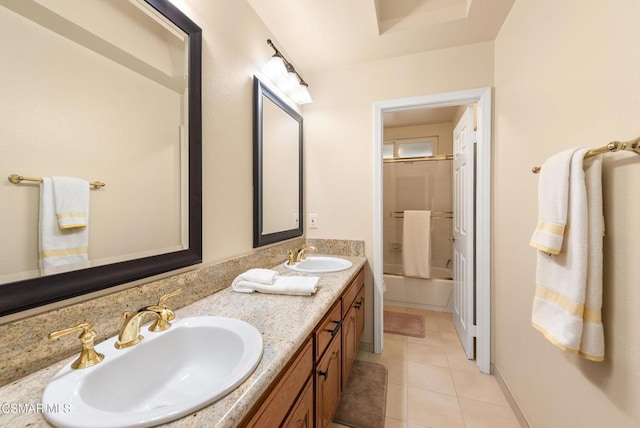 bathroom with shower / tub combination, tile patterned floors, and vanity