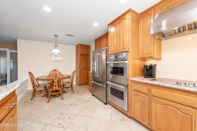 kitchen featuring stainless steel appliances, extractor fan, light stone countertops, and pendant lighting