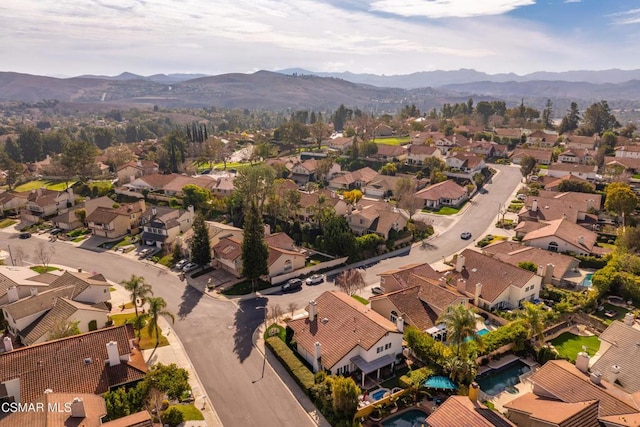 birds eye view of property with a mountain view