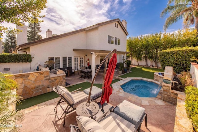 view of pool featuring a patio and pool water feature