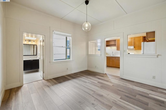 interior space featuring sink and light hardwood / wood-style floors