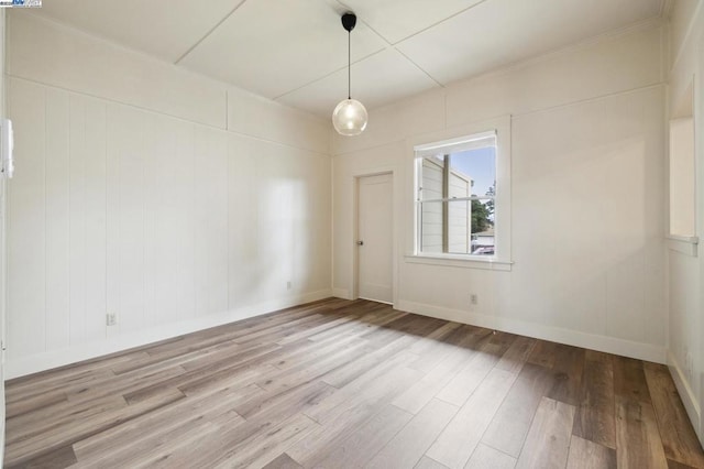 spare room featuring hardwood / wood-style flooring