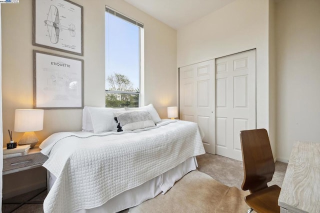 carpeted bedroom with a closet