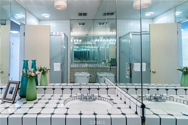 2260 N Cahuenga Blvd Unit 507, Los Angeles, CA 90068 - full bathroom featuring vanity, a stall shower, and tile walls