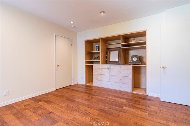 2260 N Cahuenga Blvd Unit 507, Los Angeles, CA 90068 - unfurnished bedroom featuring wood finished floors, a closet, and recessed lighting
