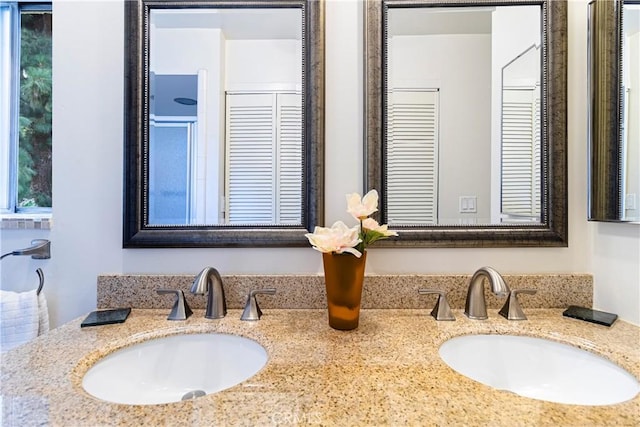 2260 N Cahuenga Blvd Unit 507, Los Angeles, CA 90068 - bathroom featuring double vanity and a closet