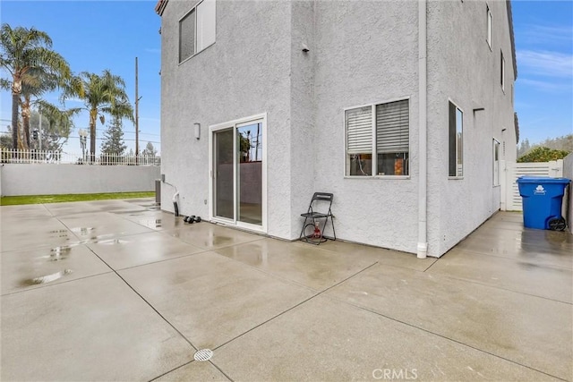 rear view of property featuring a patio