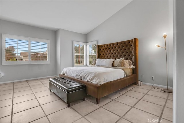 tiled bedroom with lofted ceiling