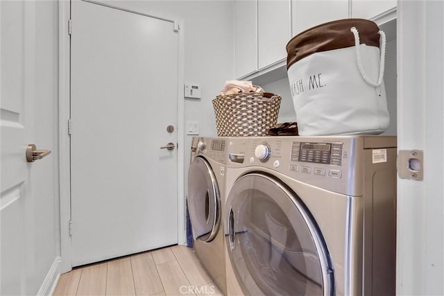 laundry area featuring cabinets and independent washer and dryer