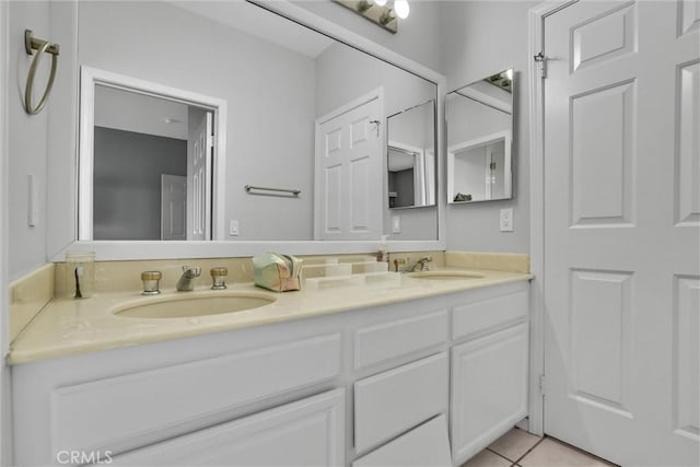 bathroom featuring tile patterned floors and vanity