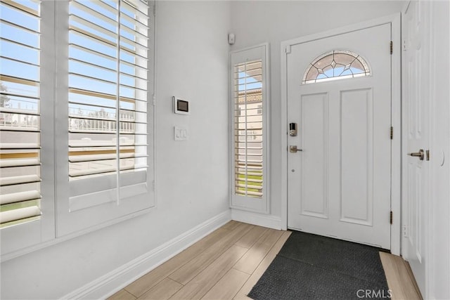 foyer entrance with light wood-type flooring