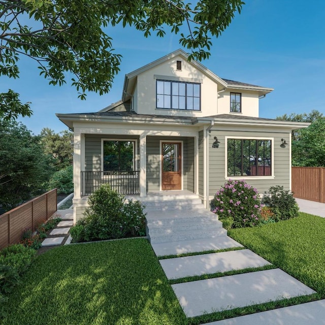 view of front of home with covered porch and a front lawn