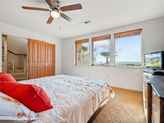 carpeted bedroom with ceiling fan