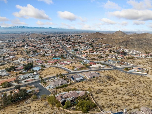 birds eye view of property with a mountain view