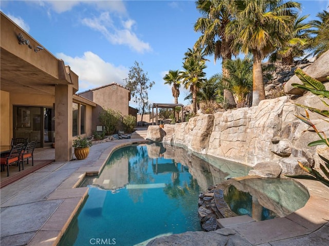 view of swimming pool featuring a patio