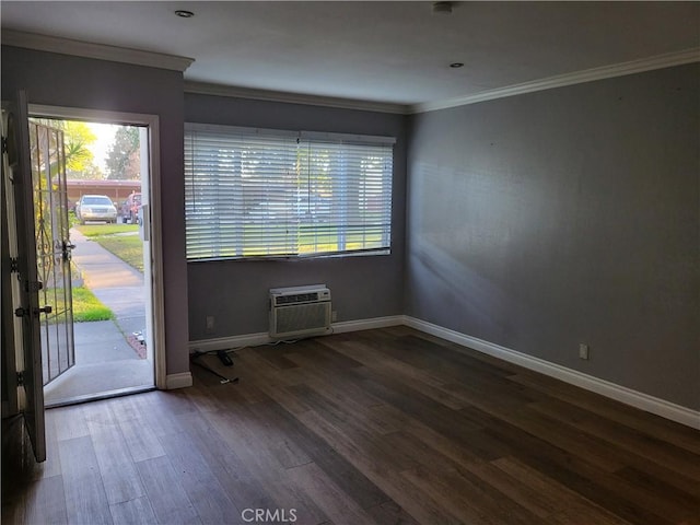 interior space featuring ornamental molding, dark hardwood / wood-style floors, and a wall mounted AC