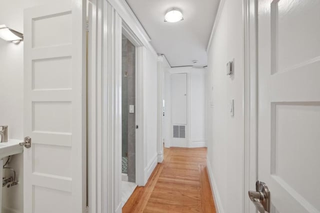 hall with light hardwood / wood-style floors