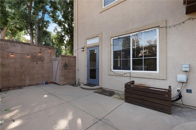 entrance to property featuring a patio area