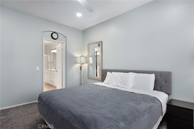 carpeted bedroom featuring ceiling fan and connected bathroom