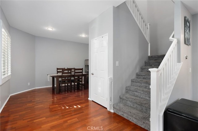 staircase featuring wood-type flooring