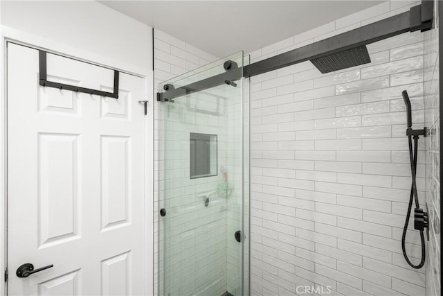 bathroom featuring an enclosed shower