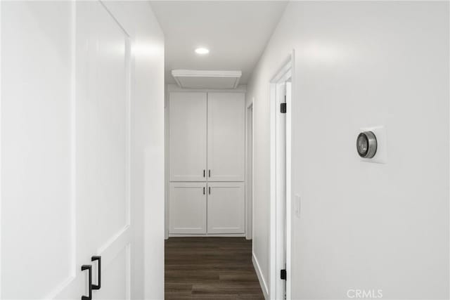 hall with dark hardwood / wood-style floors