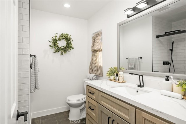 bathroom featuring tile patterned floors, vanity, toilet, and an enclosed shower