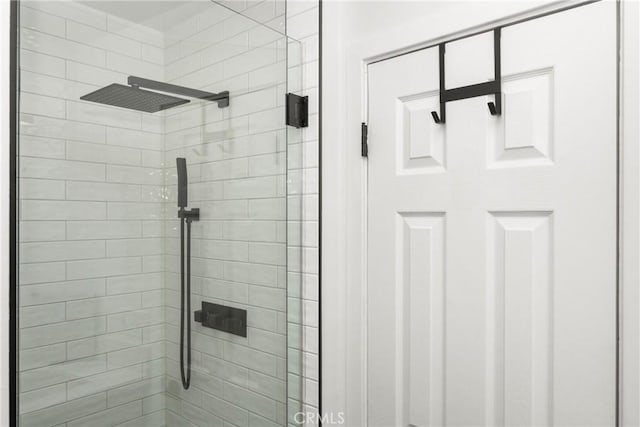 bathroom with a tile shower