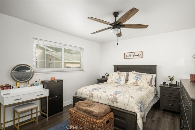 bedroom with dark hardwood / wood-style floors and ceiling fan