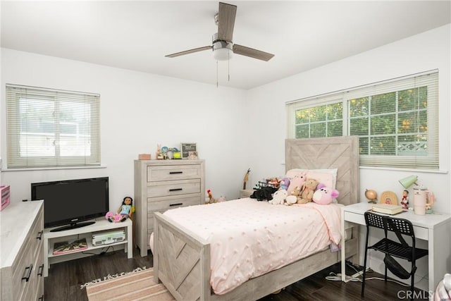 bedroom featuring dark hardwood / wood-style flooring and ceiling fan