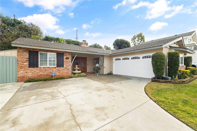 ranch-style house with a garage and a front lawn