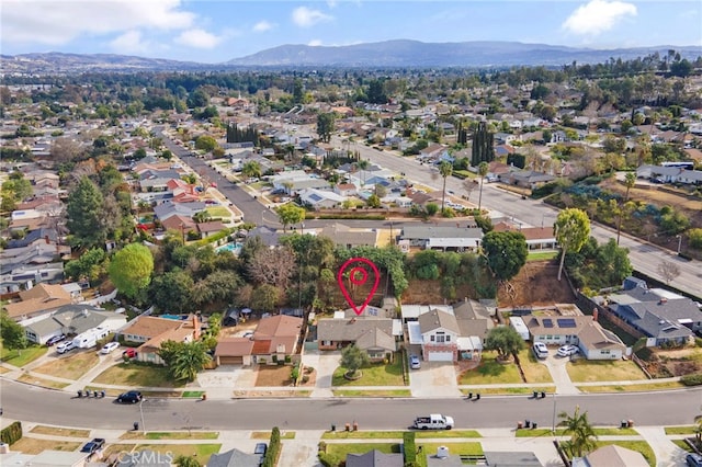 birds eye view of property featuring a mountain view