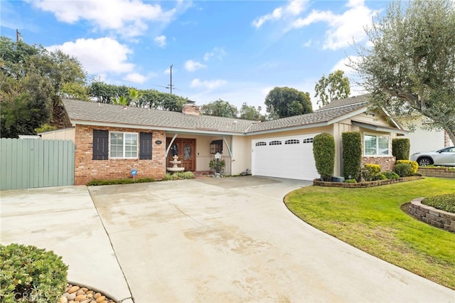 ranch-style home featuring a garage and a front lawn