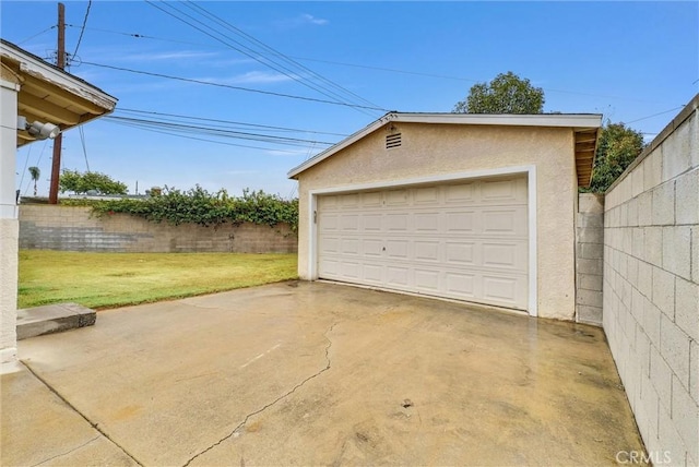 garage with a lawn