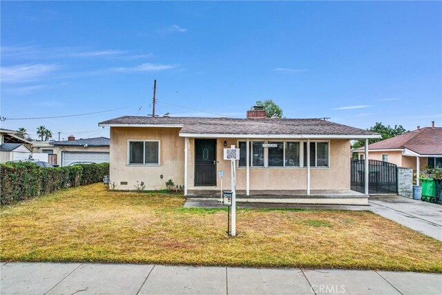 bungalow-style home featuring a front yard