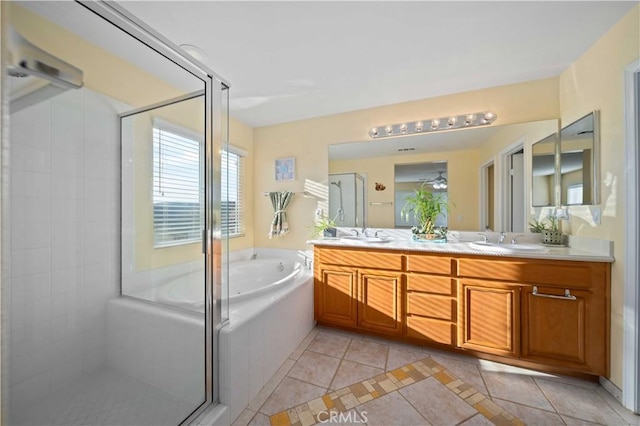 bathroom featuring vanity, independent shower and bath, and tile patterned flooring