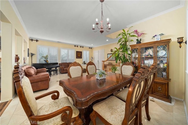 dining area featuring a notable chandelier, ornamental molding, and light tile patterned flooring