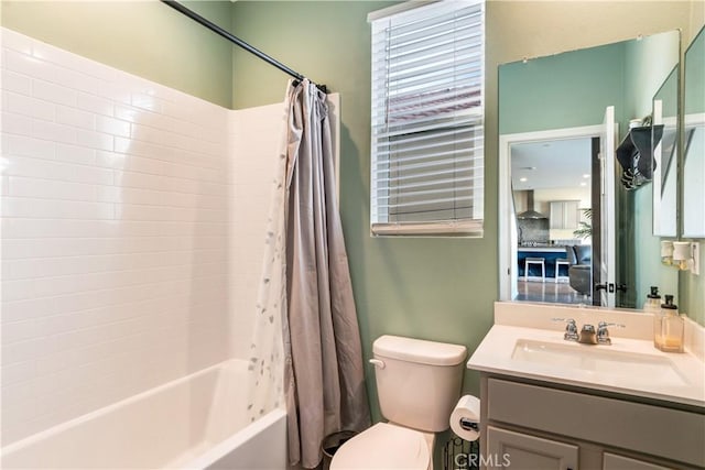 full bathroom with vanity, toilet, and shower / bath combo with shower curtain